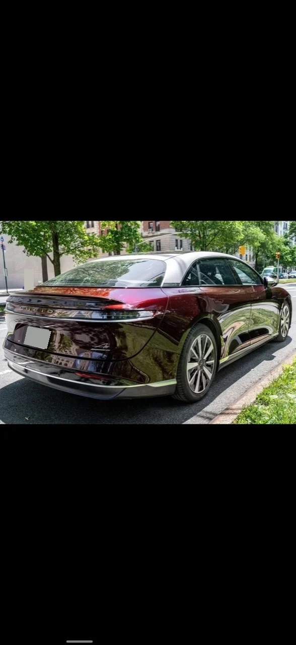 Rear-right three-quarter view of the burgundy 2022 Lucid Air Grand Touring.